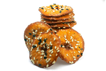 Round salty pretzels wtih black and white sesame isolated on white background high quality details