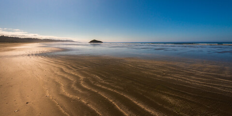 sand beach over the Pacific Ocean along the Vancouver Island coastline, British Columbia, Canada