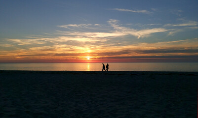 beach baltic sea sun set with people silhouett