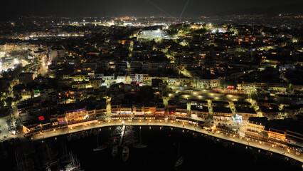 Aerial drone night shot of illuminated recently renovated round port of Mikrolimano in the heart of Piraeus, Attica, Greece