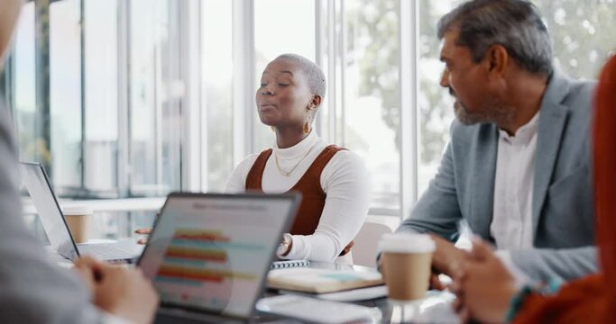 Meeting, discussion and professional black woman talking to her colleagues in the office conference room. Teamwork, presentation and African female employee in conversation with her team for project.