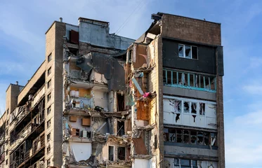 Foto op Aluminium destroyed and burned houses in the city Russia Ukraine war © Sofiia
