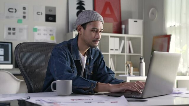 Asian man Graphic designer working in office. Artist Creative Designer Illustrator Graphic Skill Concept.