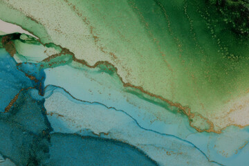 Abstract green, blue, gold glitter flow wave blots painting background. Watercolor and Alcohol ink colors. Marble texture.