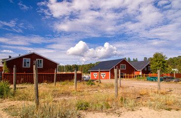 Red painted houses in the fishing village Holick