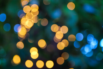 Background on the theme of the holiday. Lights out of focus.