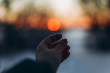 Hand reaching for the Sun. Reaching for the dreams