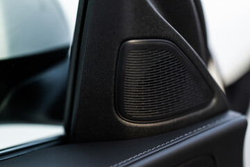 Obraz premium Close up speaker on car door. Sound speaker in a modern car.