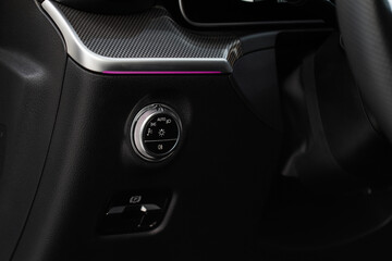 Closeup of the headlight switch control button. Lights control panel in car