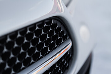 Modern car close up view of grille. Grid of car. Radiator grille.
