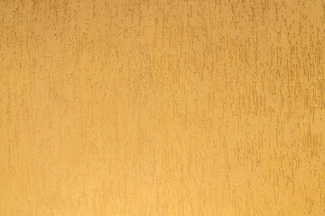 Surface puttied with decorative putty as a background. Preparation of facade walls