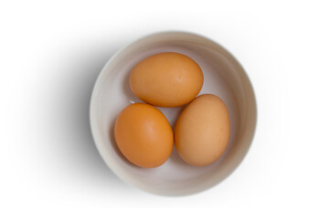 Whole eggs in a plate isolated on white background