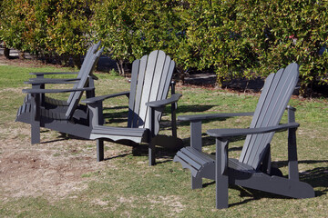 Gray Adirondack chairs outdoors in the garden