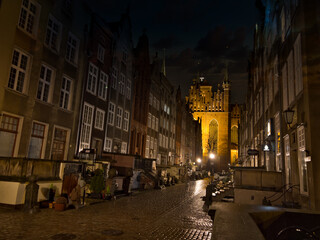 View of the street in the center of the old town at night. Architecture of an old historic street in Gdansk. Old town tourist attraction. Gdansk, Poland.