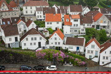 Aerial city view with traditional wooden houses and red roofs at early morning. Stavanger, Rogaland, Norway