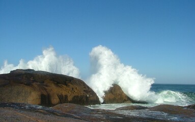 wave crashing over rocks