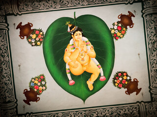 Vivid and colorful statue of the Hindu god, painted on a wall,  in the Sri Mariamman Temple, Singapore. - 559213518