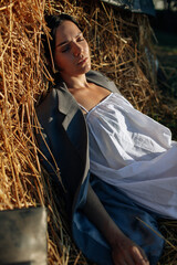 Beautiful hippie girl lying in a grass. Modern boho style. Beauty, fashion, - 559213527