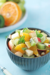 Fototapeta na wymiar A bowl with fresh fruit salad 