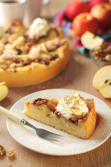 Obraz na płótnie Canvas Apple pie with walnuts - typical autumn dish 