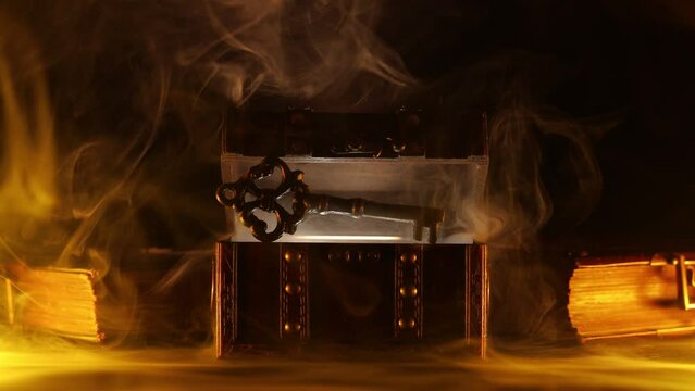 Mysterious chest and key on a dark background. Panoramic mockup for your logo. Horizontal banner with copy space for popular social media website cover image.
