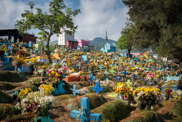 Toumbs and colored cross in Chichicastenango graveyard