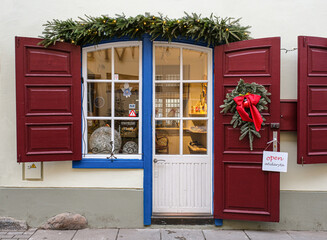 Christmas ornamented window and door on Stikliu street, old town Vilnius, Lithuania