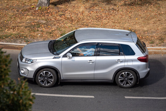 Moscow, Russia - September 27, 2022: Silver metallic Japanese car Suzuki Vitara is driving down the road on a city street (Grand and Suzuki Escudo)