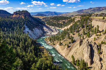 Yellowstone River and Canyon with blue cloudy sky in autumn