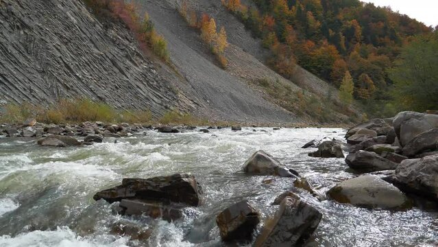 Mountain river with rapid current. The Prut river and mountain folds in Yaremche City, Ukraine, known as Yaremche folds - biggest outcrop of Stryi formation in Europe, video with water noise