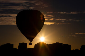 A Hot Air Balloon silhouetted by the sunrise in Melbourne