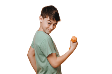 Cheerful young boy dressed in a green t-shirt, winks and doing exercise with dumbbell to improve his physical state, over transparent background. Active and optimistic people concept.