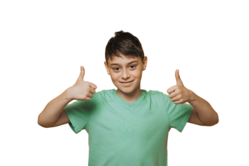Portrait of attractive young school boy dressed in a green t-shirt, cute smiling showing thumbs up over transparent background, isolated. Copy space. Success people emotions.