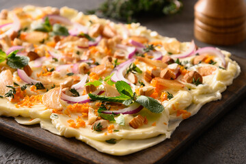 Homemade viral trendy Butterboard with onion, garlic, orange, herbs , crispy baguette and toasts on dark background. Close up.