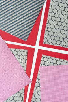 red card stock and scrapbook paper sheets with pattern: stripes, honeycomb, and grids