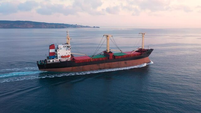 Cargo ship sailing northbound on Istanbul Strait. (Aerial view)  A bulk carrier or bulker is a merchant ship specially designed to transport unpackaged bulk cargo, such as grains, ore, coal or timber
