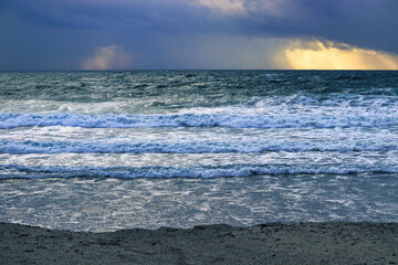 stormy waves at sunset