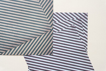 scrapbook paper sheets with striped optical illusion pattern