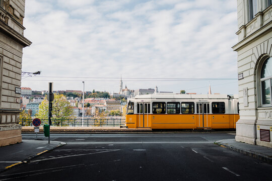 Line 2 tram between buildings in Budapest, Hungary