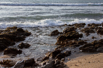 Waves breaking over rocks