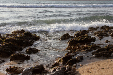 Fototapeta na wymiar Waves breaking over rocks