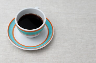 Colorful cup of black coffee, clean shot, no props.