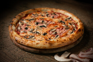 delicious pizza with bacon or ham and mushroom