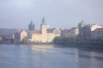 Landscape of Prague and Vltava river at Novoneho lavka in misty autumn morning