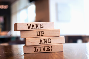 Wooden blocks with words 'Wake Up and Live'.