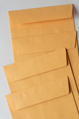 four kraft paper envelopes with closed flap