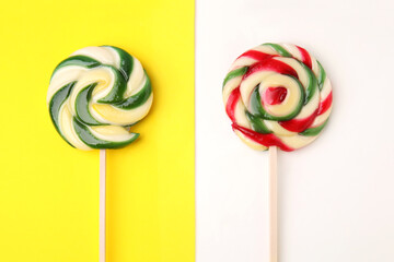 Sweet lollipops on color background, flat lay