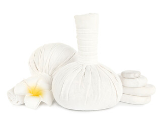 Fototapeta na wymiar Herbal massage bags, flower and spa stones on white background