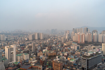 Fototapeta na wymiar Cityscape of Seoul capital of South Korea on a smoggy day