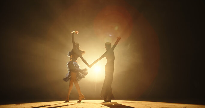 Two little asian ballroom dancers performing some latin dance. Young talented choreographers showing art - childhood dream, childhood memories concept 